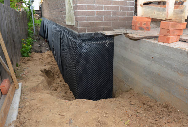 Happy homeowners after waterproofing job in Scottsboro